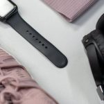 Smartwatches - Black and Silver Headphones Beside Red and Black Headphones