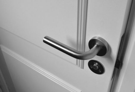 Home Security Systems - Semi Open White Wooden Door
